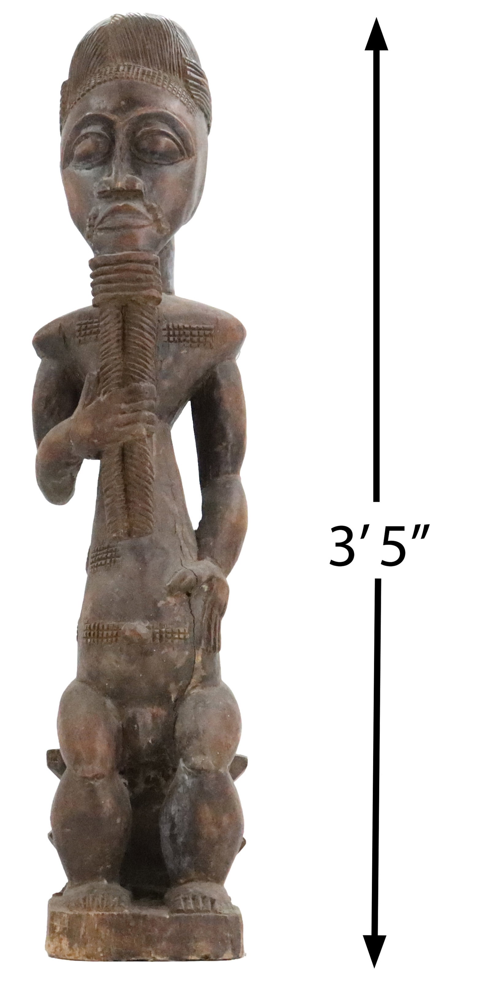 African Baule Bolo Bian Carved Wooden Ritual Figure: African Baule Bolo Bian Carved Wooden Ritual Figure. From the Ivory Coast, it depicts a seated male with elaborate coiffure and scarification marks holding a long, ribbed object to his