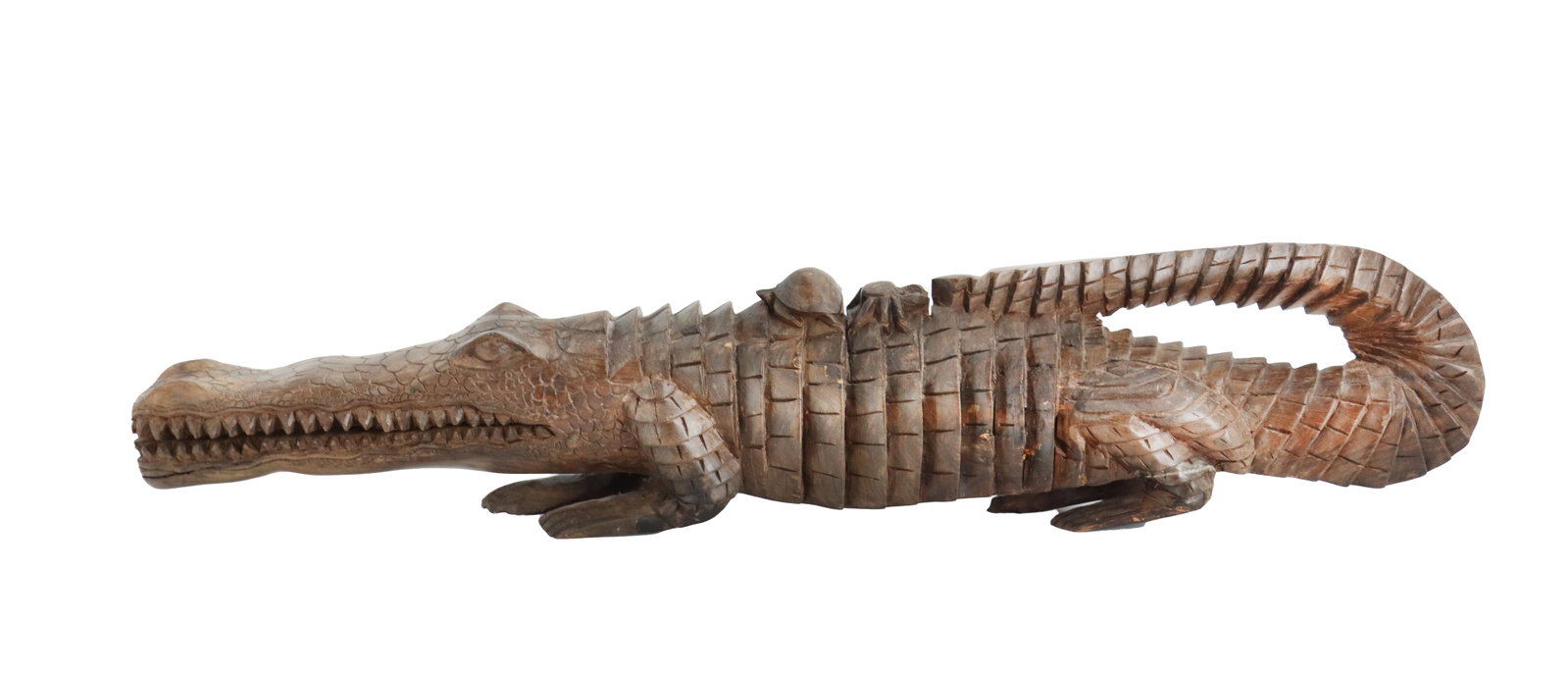 Tanzania Handcarved Ebony Wood Crocodile: Tanzania Handcarved Ebony Wood Crocodile. Detailed hand-carved wooden crocodile sculpture featuring a smaller animal perched on its back and a tail that curves forward to touch its hindquarters. Size: