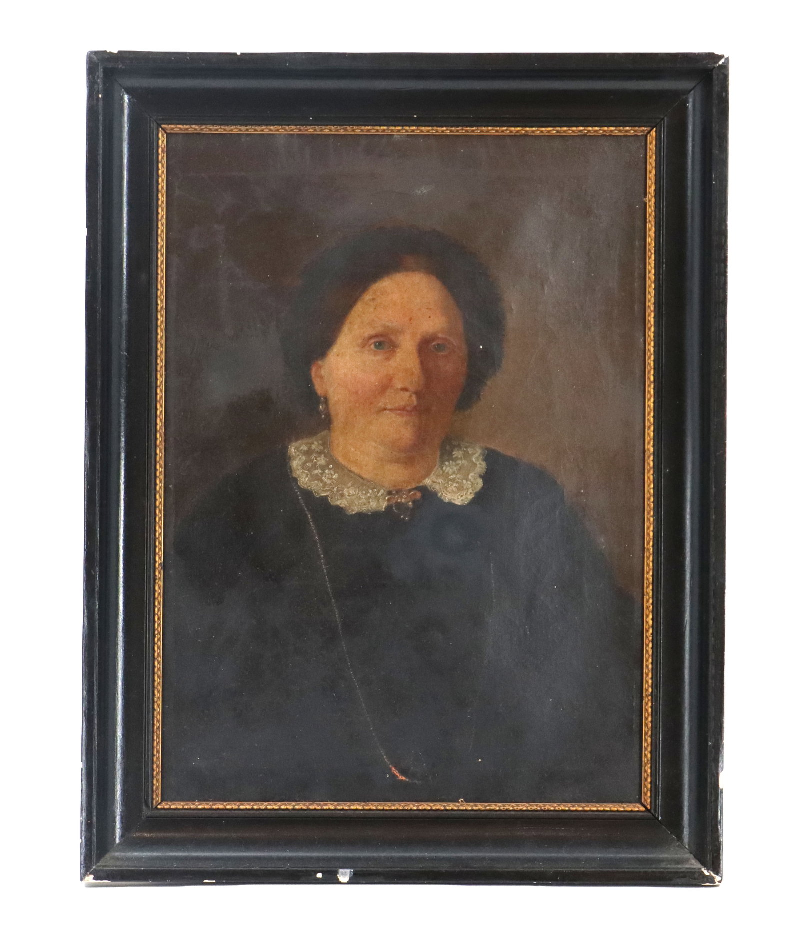 19th Century Oil on Canvas Traditional Portraiture of a Woman: 19th Century Oil on Canvas Traditional Portraiture of a Woman. Antique oil portrait of an older woman with dark hair and a lace collar, set within a dark wooden frame with a gold inner border. Fr