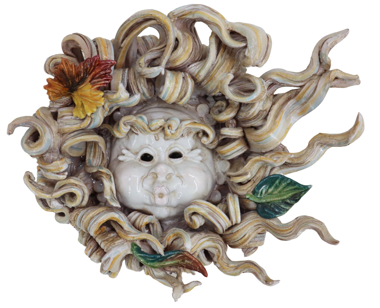 Italian Apolito Ceramiche Ceramic Mask Wall Art of Aeolus: Italian Ceramic Mask Wall Art of Aeolus. Ceramic wall sculpture of the wind god Aeolus, featuring a cherubic face with puffed cheeks surrounded by an elaborate explosion of flowing, cream and ochre-ri