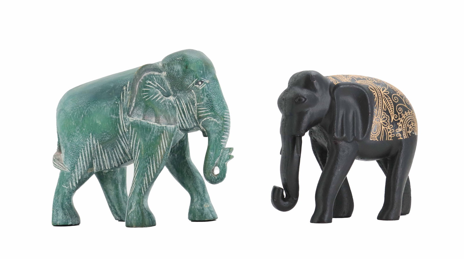 (2) German Carved Wood and Resin Elephant Sculptures: (2) German Carved Wood and Resin Elephant Sculptures. The larger piece is wood and stained in a rich jade green color with carved lines accented in white paint. It has an original pape