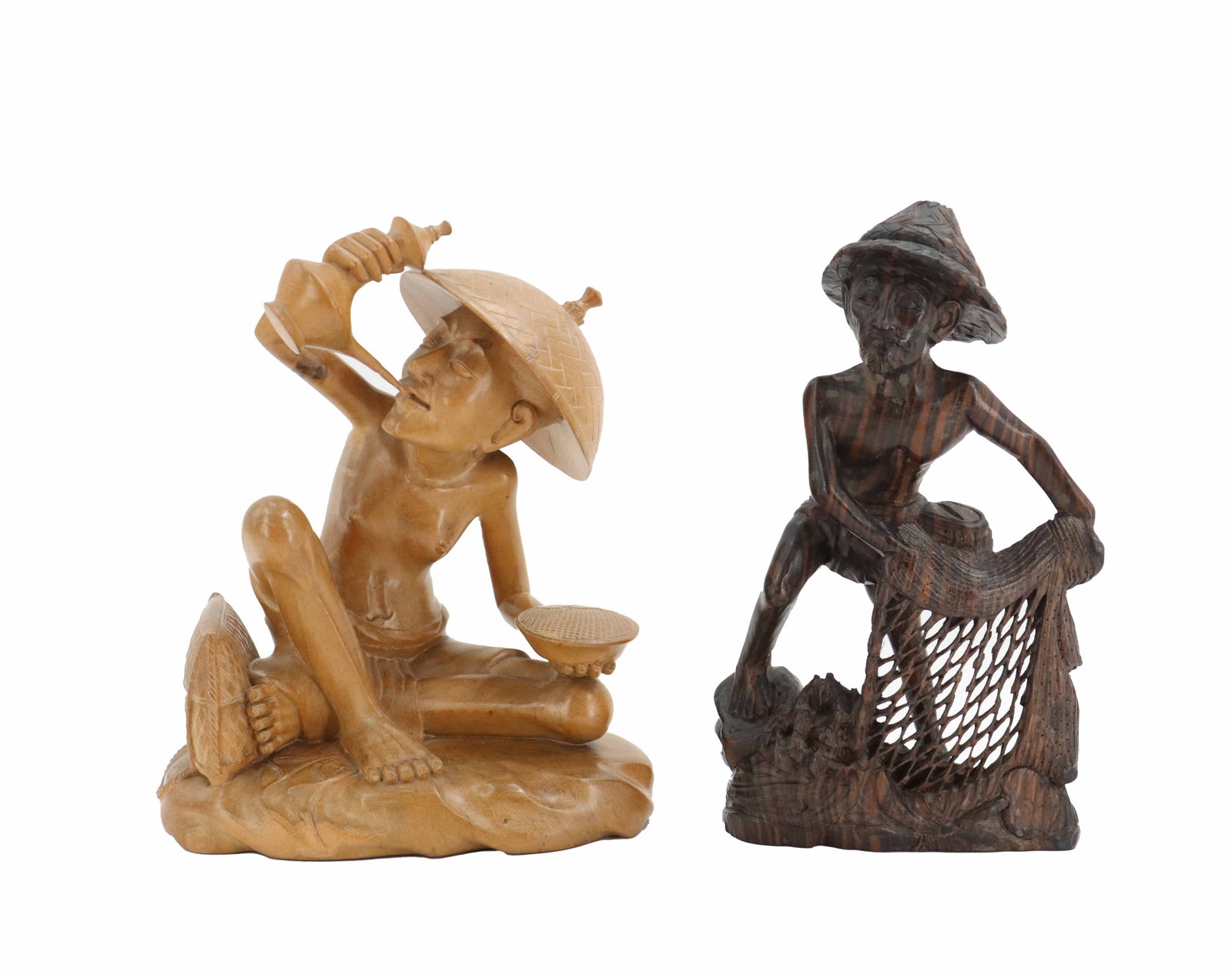 (2) Balinese Folk Art Hand Carved Wooden Worker Figures: (2) Balinese Folk Art Hand Carved Wooden Worker Figures. One is a lighter, more polished wood, and the other is darker with heavy grain in a more rustic style. The lighter one depicts a man in a large