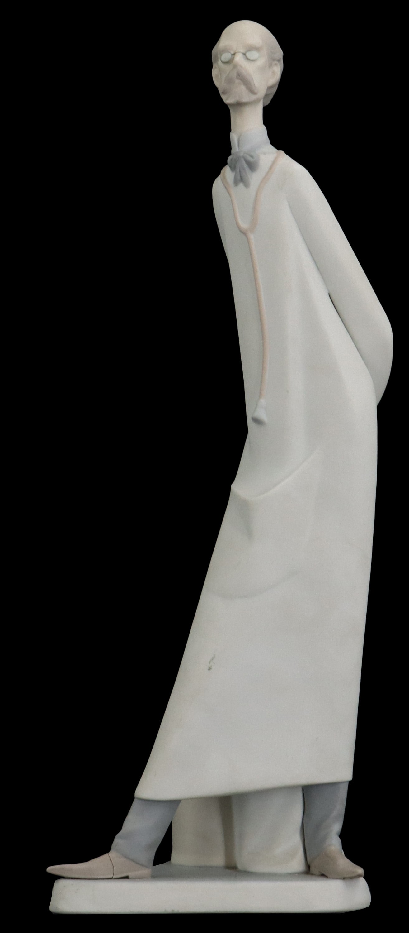 Lladro Porcelain Figure of Doctor: Lladro Porcelain Figure of Doctor. A slender, stylized porcelain figurine of a doctor or pharmacist, featuring the characteristic elongated proportions and muted pastel palette of the