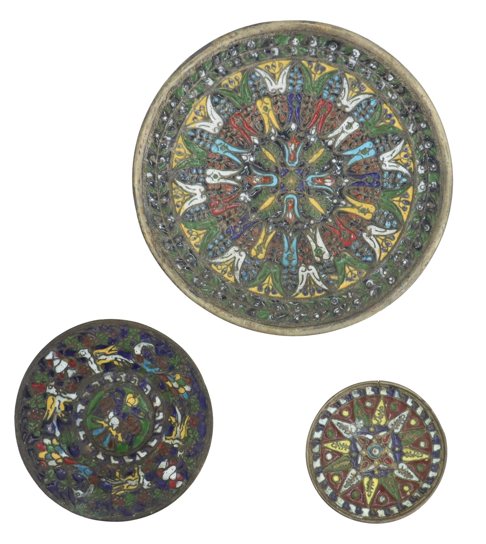 (3) Antique Enamel and Brass Byzantine Style Plates: (3) Antique Enamel and Brass Byzantine Style Plates. Group of three circular metal plates or coasters featuring vibrant champlevé enamel work in intricate geometric and floral patterns