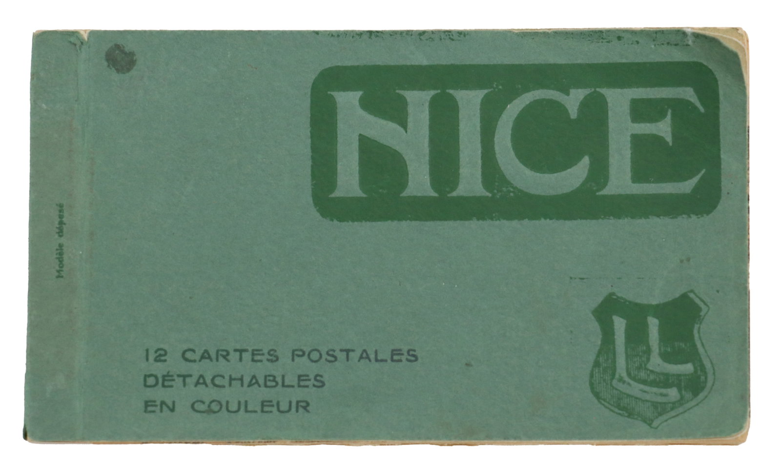 Vintage Nice, France Postcard Booklet: Vintage green postcard booklet for Nice features a bold, Art Deco-style title and contains twelve detachable color postcards. Postcards with handwritten notes. Size: 6 x 3 1/2 x 1/4 in. 