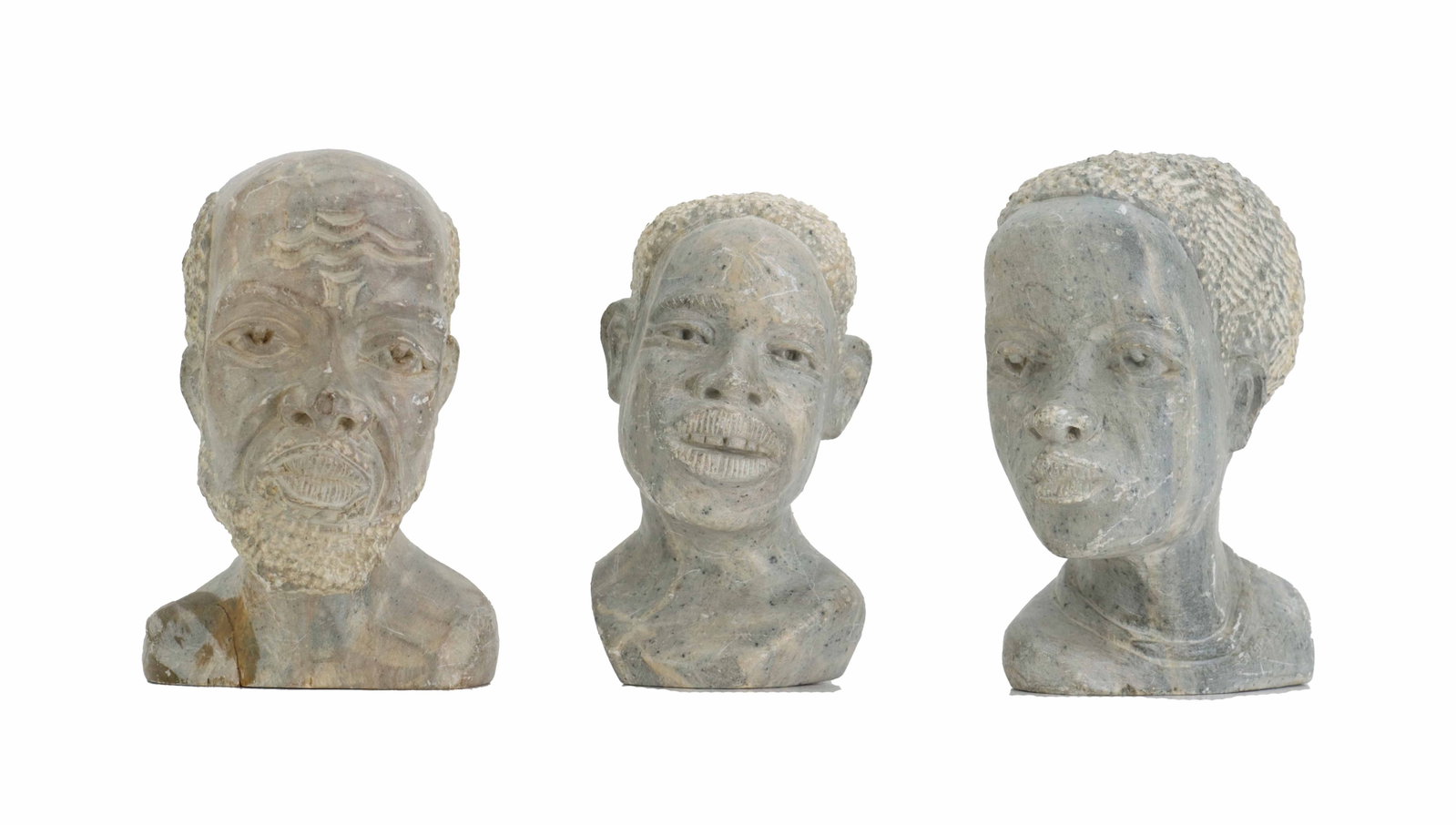 (3) African Shona Soapstone Hand-Carved Busts: (3) African Shona Soapstone Hand-Carved Busts. Depicts a family unit, with a balding older male, an older female, and a younger male with similar features and head positions. All signed or marked indi