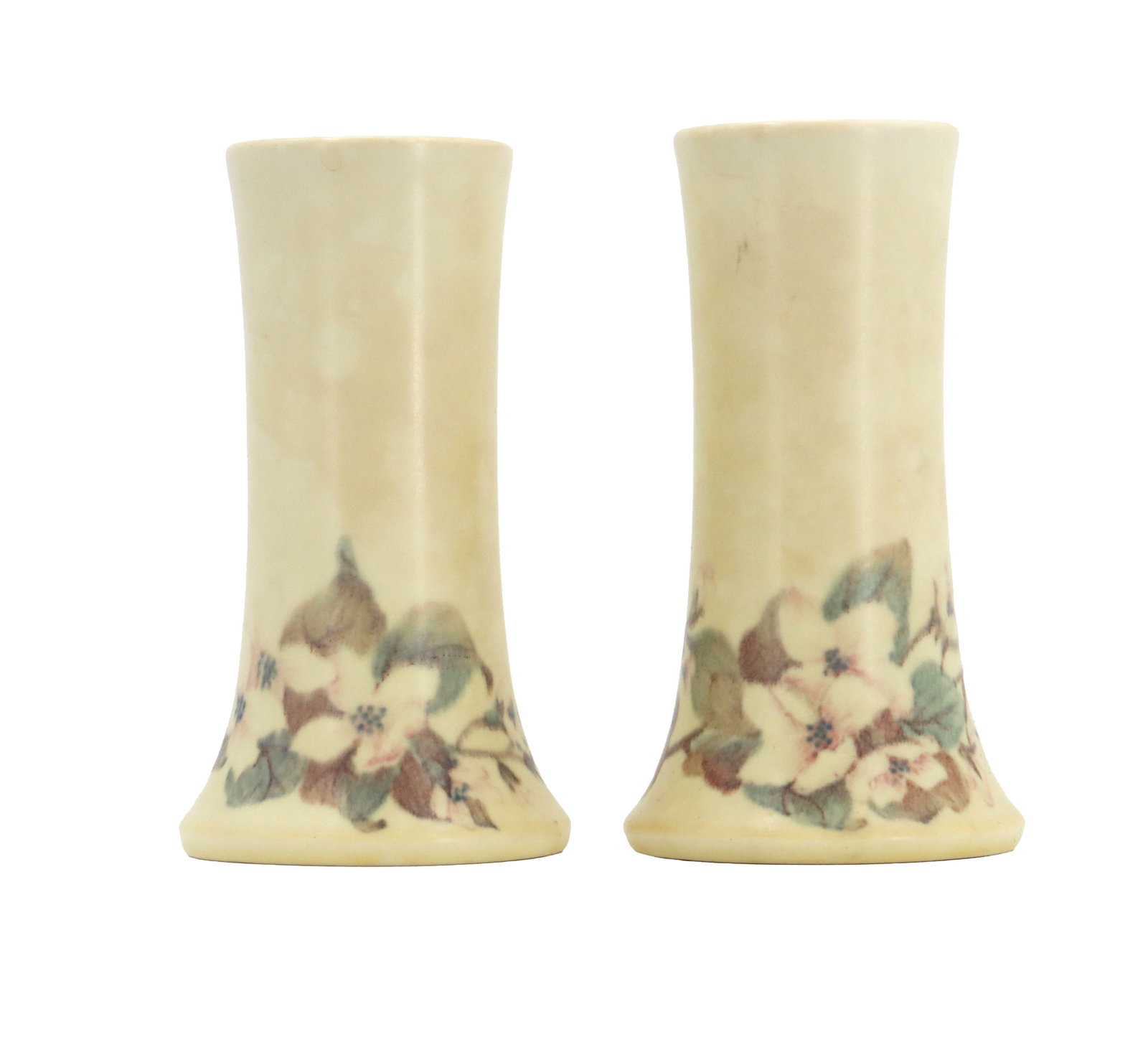 (2) Rookwood Pottery Vellum Glazed Flower Vases: (2) Rookwood Pottery Vellum Glazed Flower Vases. Pair of Rookwood Pottery vellum-glazed cylindrical vases, each adorned with a soft, hand-painted floral dogwood motif typical of early 20th-century Art