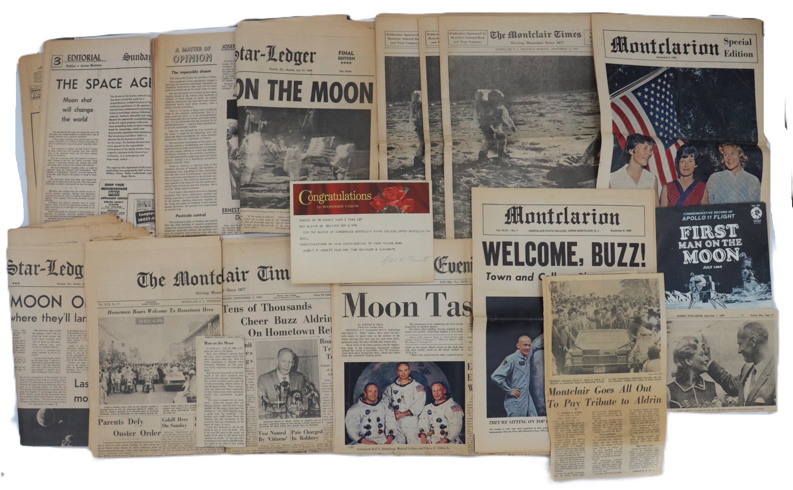Collection of Astronaut Newspaper Articles and Apollo 11 Vinyl Record: Collection of Astronaut Newspaper Articles and Apollo 11 Vinyl Record. A plethora of cut-out articles about the incredible event, many from Montclair, New Jersey. The record is "a commemorative r