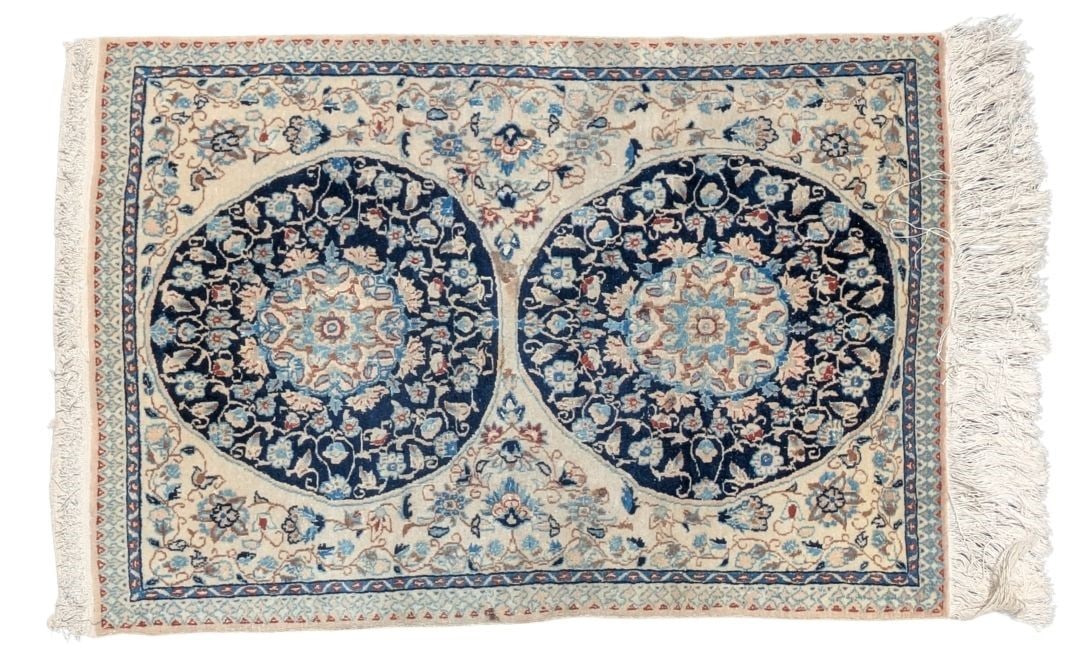 Nain Persian Silk Double Medallion Rug: Size: 29 1/2 x 21This Nain Persian rug features a classic cream and navy blue colorway. The design showcases twin circular medallions surrounded by intricate, scrolling floral motifs. While it resembl