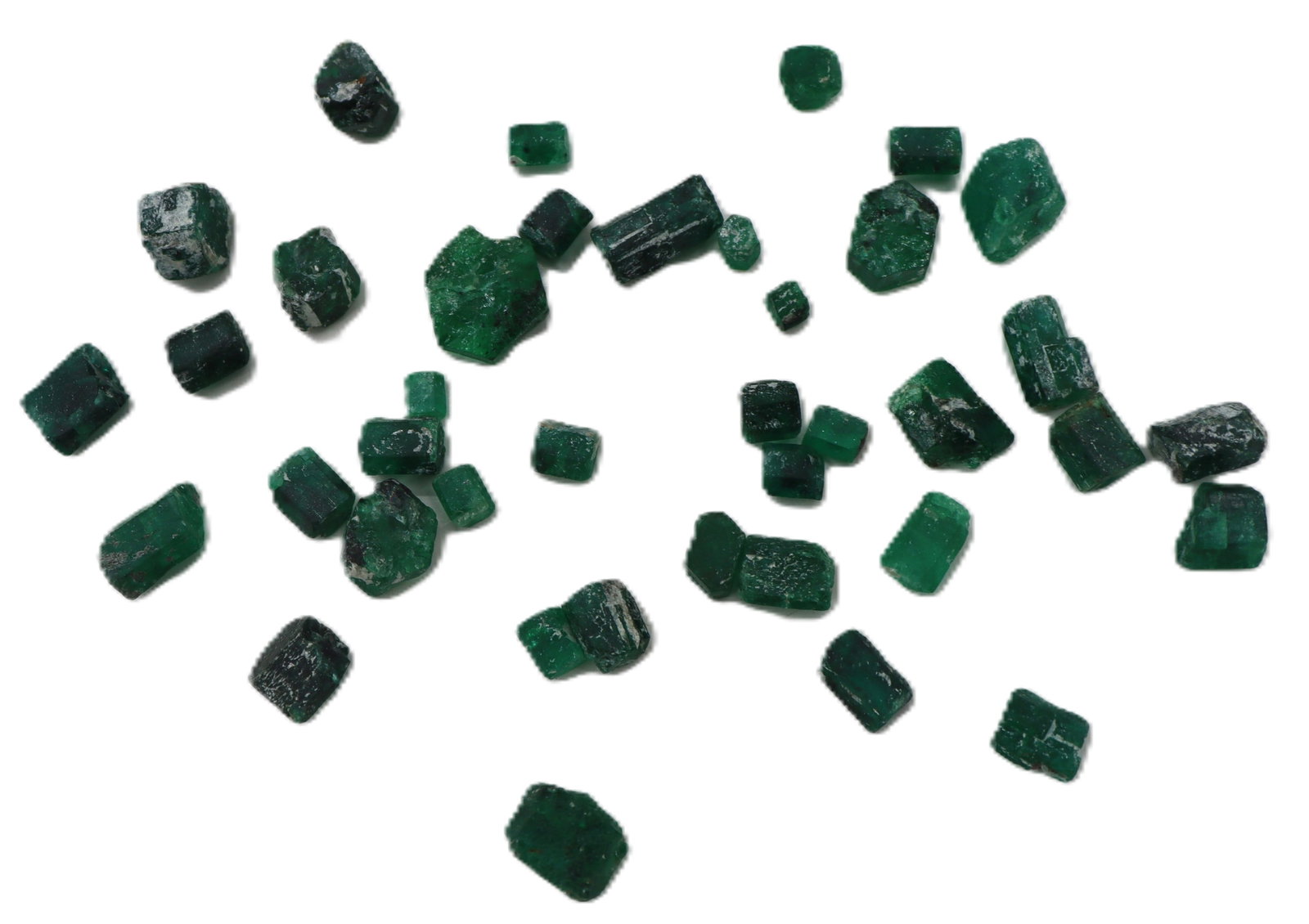 Collection of Small to Medium Rough, Brazilian Emerald Crystals: Collection of Small to Medium Rough, Brazilian Emerald Crystals. Medium to deep vivid green, with varying degrees of dark inclusions. Approximately 120.54 ct. 
