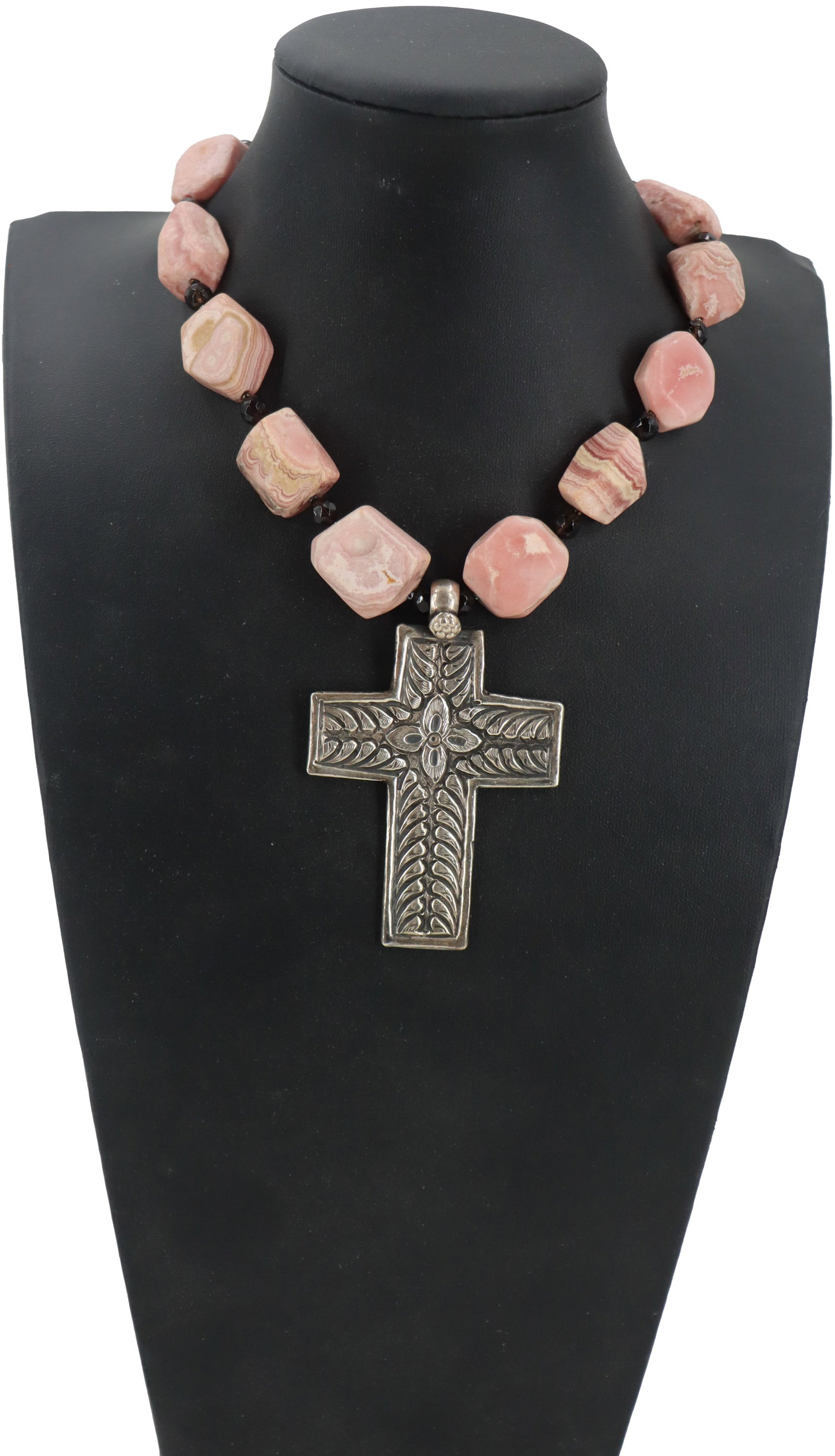 Sterling Silver, Onyx, and Rhodochrosite Necklace - Gross 5.2 ozt.: Sterling Silver, Onyx, and Rhodochrosite Necklace. Cross marked on back. Rhodochrosite and onyx beaded necklace with a sterling silver cross pendant. Single strand. Length: 20 in. Gro