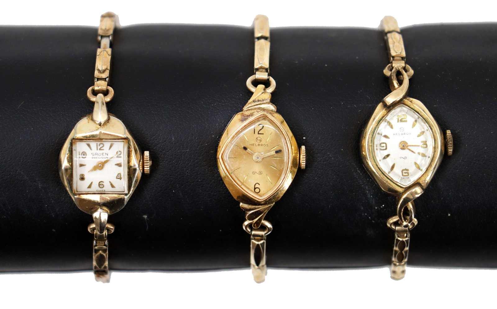 (3) Vintage Gruen and Helbros Stainless Steel and Rolled Gold Plate Wrist Watches: (3) Vintage Gruen and Helbros Stainless Steel and Rolled Gold Plate Wrist Watches. 2 are Helbros with a unique twisted body and face, 1 is Gruen with a similar twisted oval body but square face. 