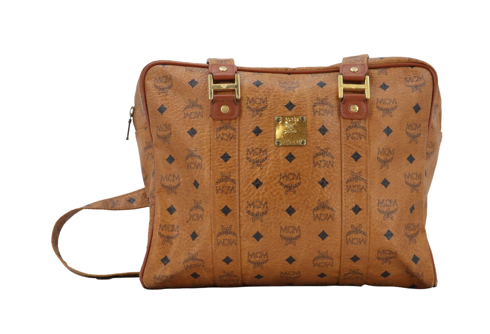 MCM Visetos Saddle Brown Coated Canvas Document Bag: MCM Visetos Saddle Brown Coated Canvas Document Bag. Classic patterning with a metal tag on the front that includes the serial number X3846. Comes with a drawstring dustbag from The RealReal. Si