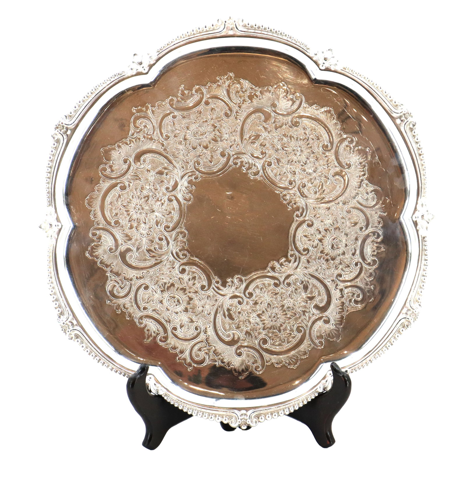 English Henry Birks & Sons Silverplated Dish: English Henry Birks & Sons Silver Plated Dish. Round Birks Regency Plate silver-plated salver tray featuring a Chippendale-style scalloped edge, a beaded border, and an intricately chased floral