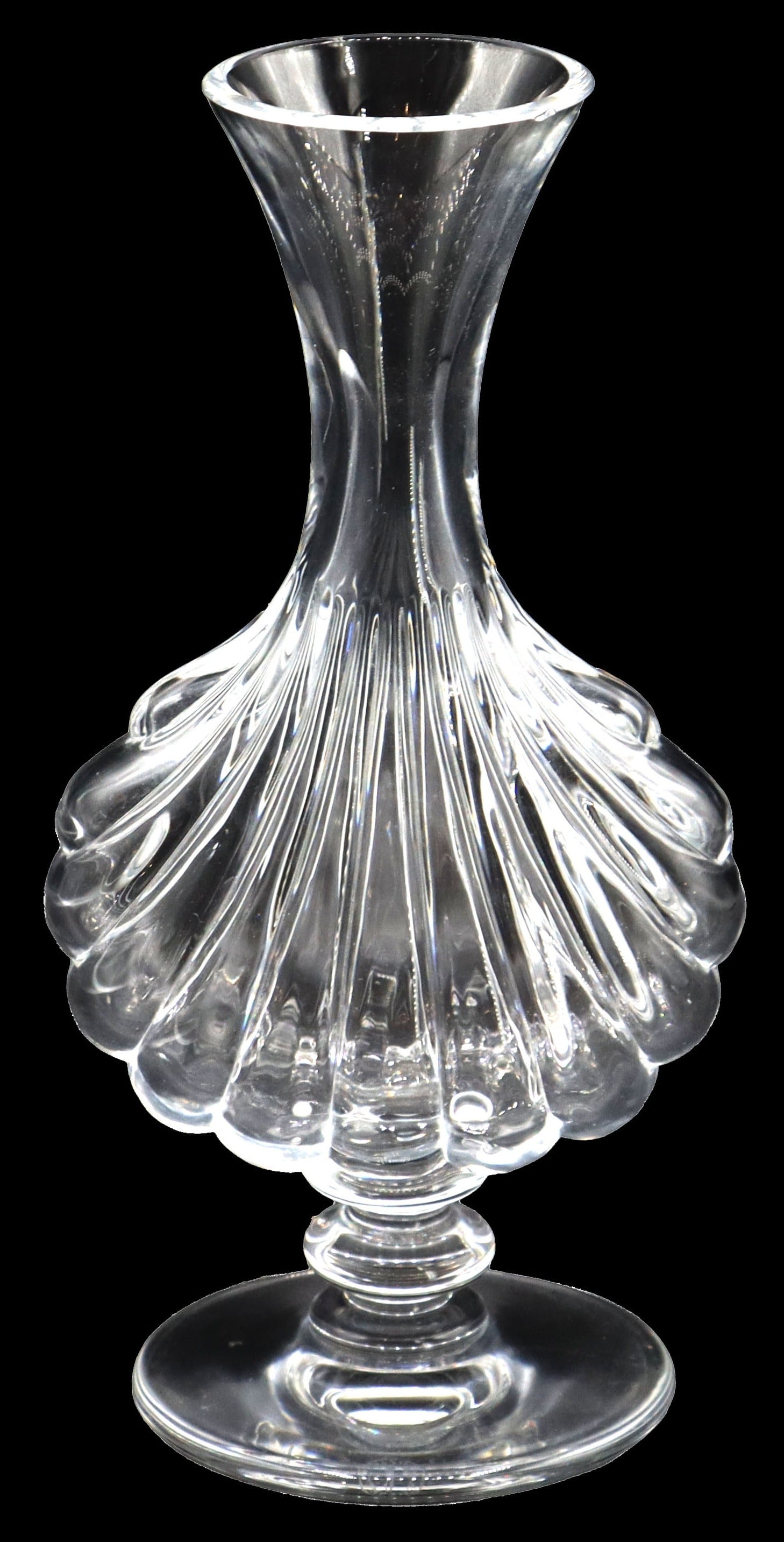Baccarat Crystal Primevere Vase: Baccarat Crystal Primevere Vase. The footed bud vase features a ribbed shell-shaped motif, and is marked on the underside. Size: 9 1/2 x 8 1/2 in. Baccarat Glass was established