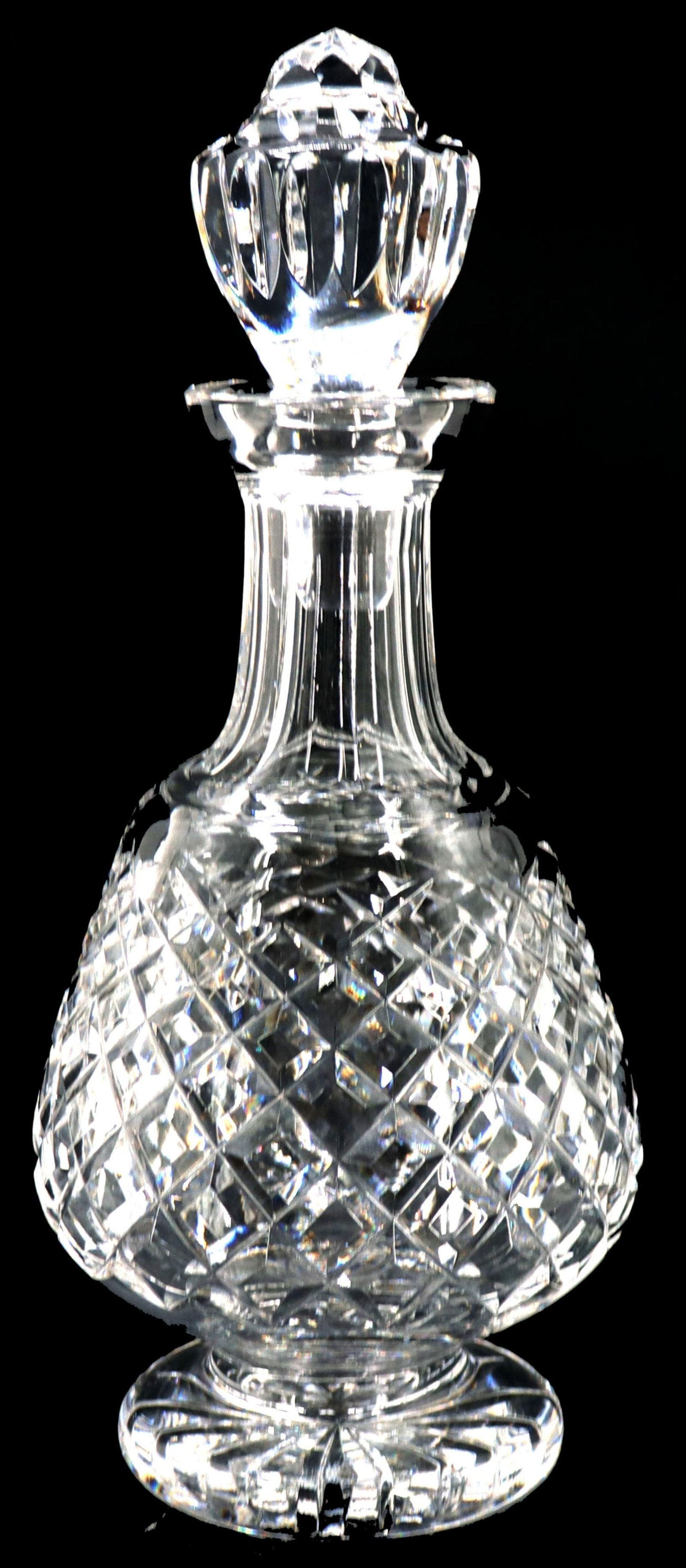 Waterford "Alana" Cut Crystal Decanter: Waterford "Alana" Cut Crystal Decanter. With stopper. Condition: Small chip on side, seen in two images. Size: 12 x 4 3/4 in. Waterford Crystal is a manufacturer of lead