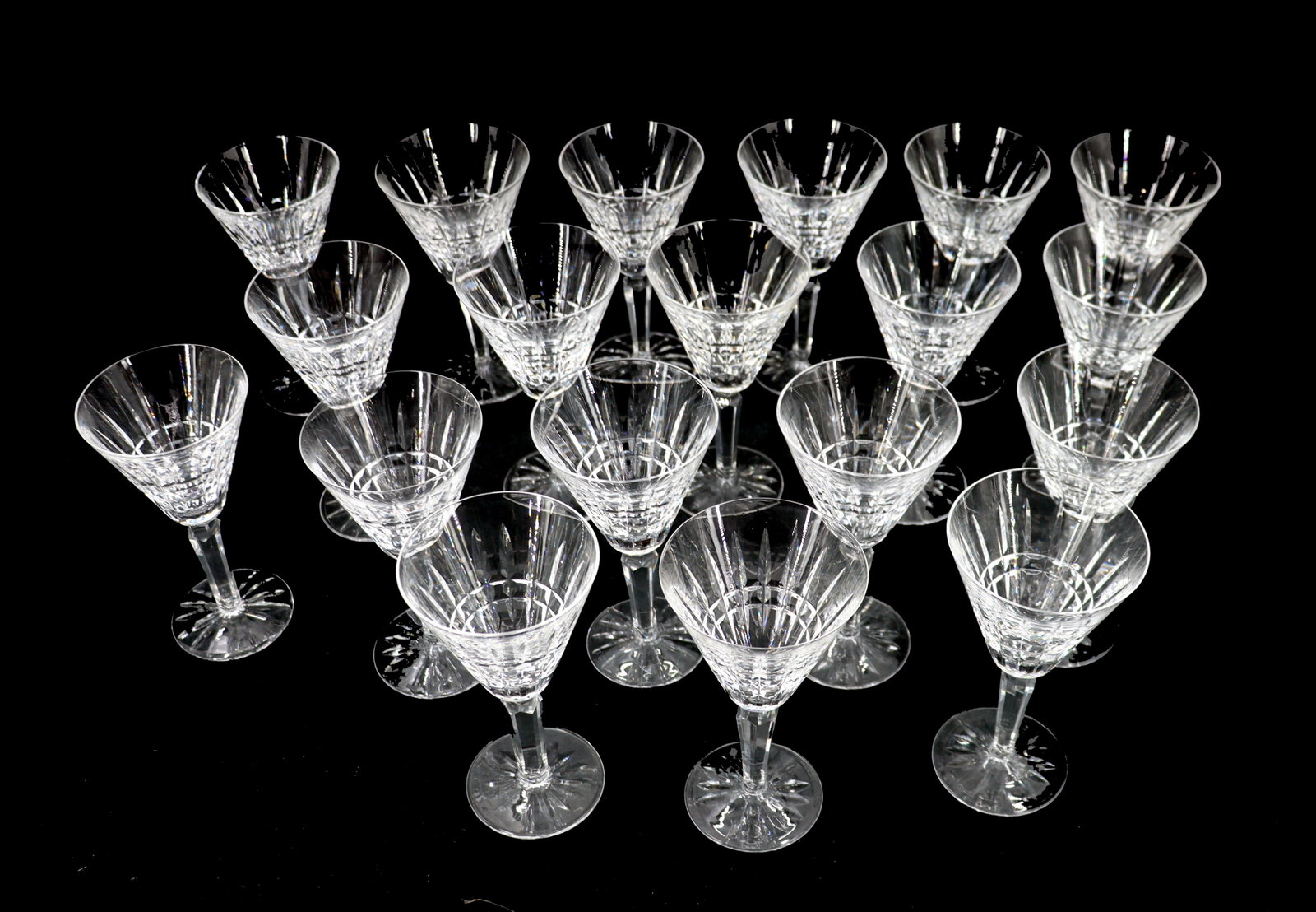 (19) Waterford Crystal White Wine Glasses: (19) Waterford Crystal White Wine Glasses. Marked on undersides. Size: 6 1/2 x 3 1/2 in. Waterford Crystal is a manufacturer of lead glass or “crystal,” especially in cut glass