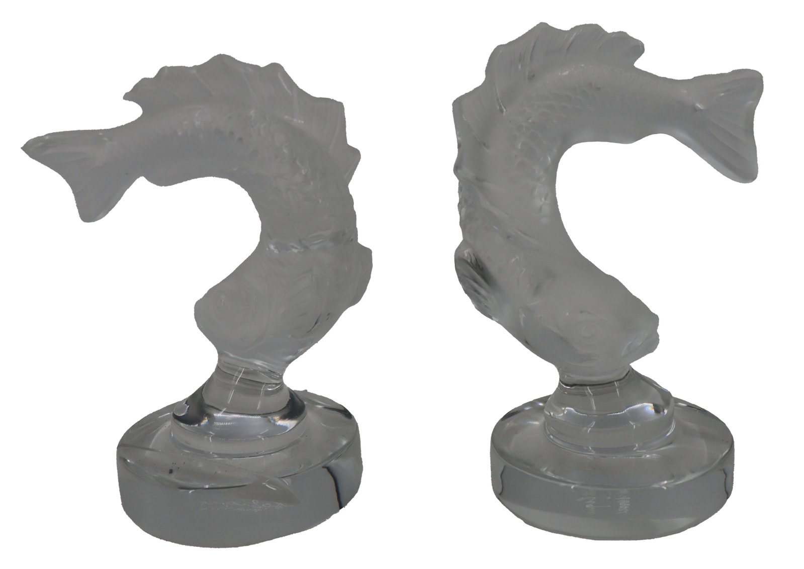 Pair of Lalique Frosted Crystal Leaping Fish Place Card Holders: Pair of Lalique Frosted Crystal Leaping Fish Place Card Holders. Marked. Size: 3 x 2 x 4 in. Lalique is a French luxury glassmaker, founded by renowned glassmaker and jeweler Ren&eacu