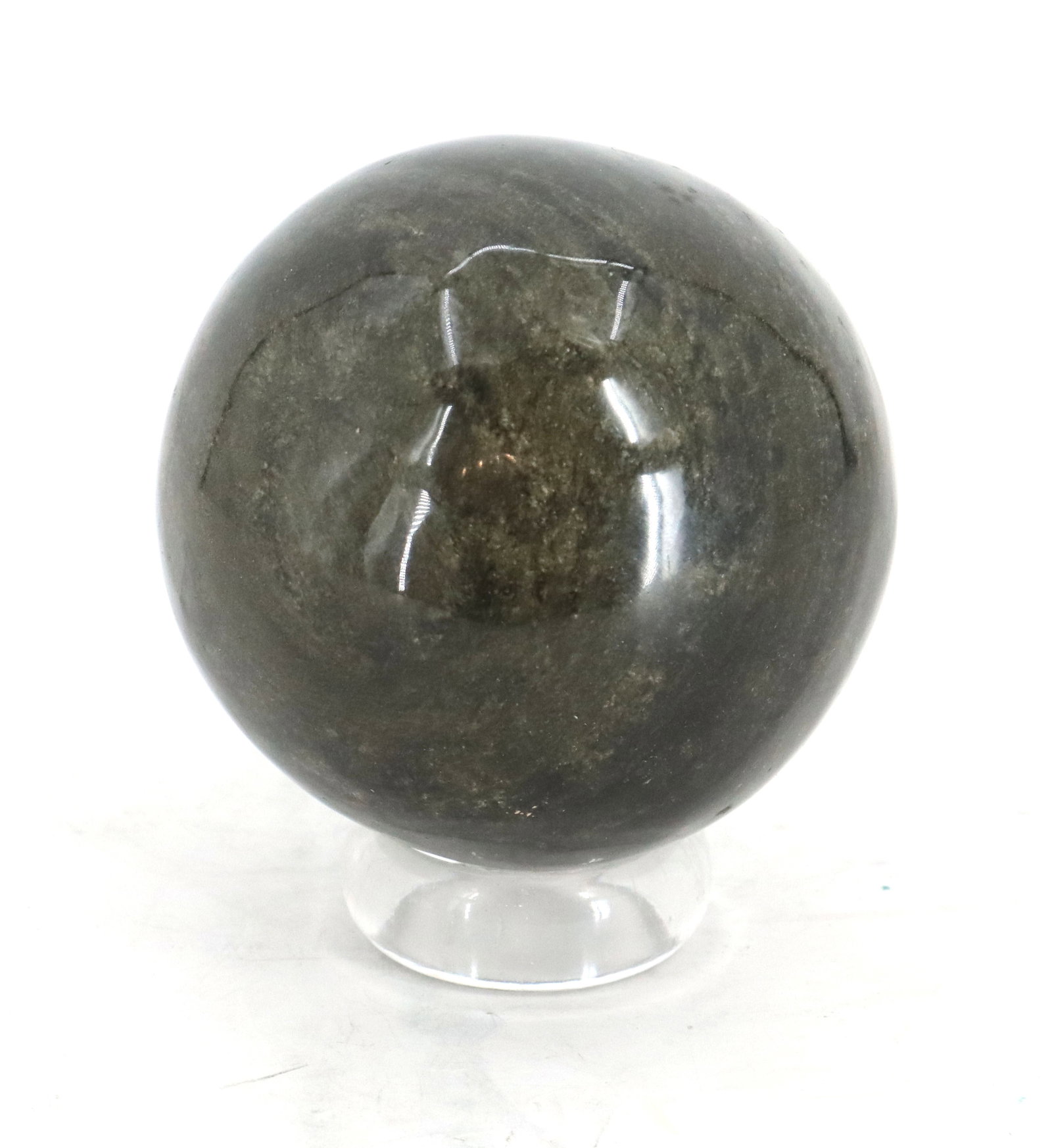 Deep Earth Tone Orb With Clear Acrylic Stand: Deep Earth Tone Orb With Clear Acrylic Stand. Carved and polished to a glossy finish. The surface reveals captivating natural mineral patterning, subtle speckling, and internal veining. 