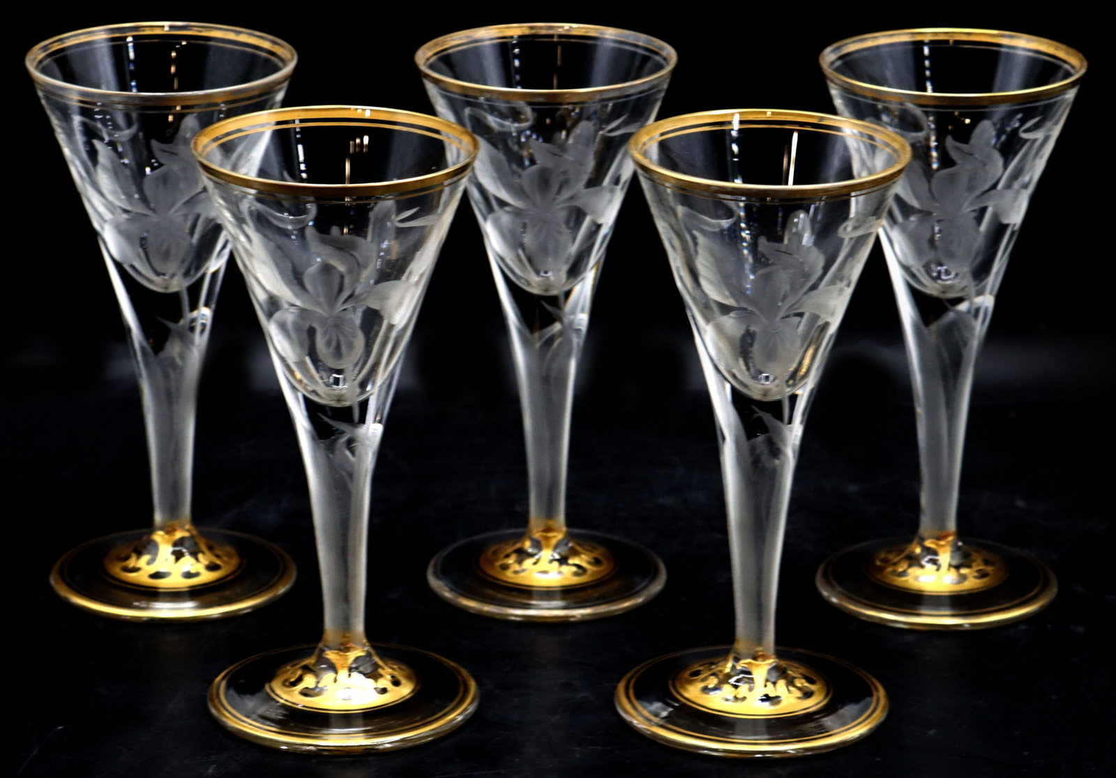 (5) Etched Crystal Cordial Glasses with Gilt Detailing: (5) Etched Crystal Cordial Glasses with Gilt Detailing. Each exquisite piece has an orchid pattern on it, with gold lines and shapes at the top and bottom of the flared stemware. Unmarked. Size: