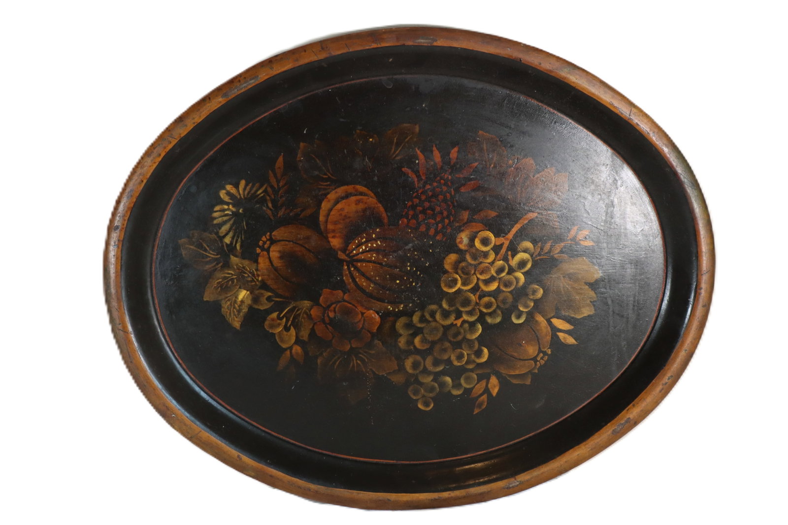 Antique Hand-Painted Toleware Serving Tray: Antique Hand-Painted Toleware Serving Tray. Depicts a fruit basket motif on a black ebonized background. Condition: Some loss to lacquer. Size: 25 3/4 x 20 1/2 in. Toleware refe