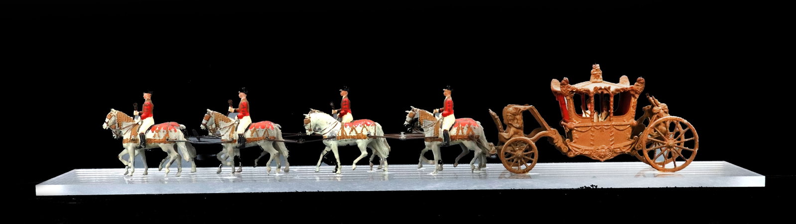 Britains Die-Cast Model of Elizabeth II Coronation Gold State Coach and 8 Horses: Britains Die-Cast Model of Elizabeth II Coronation Gold State Coach and 8 Horses. 4 of the horses are ridden, meaning 4 other figures are now missing from the original set, and the Queen and her Conso