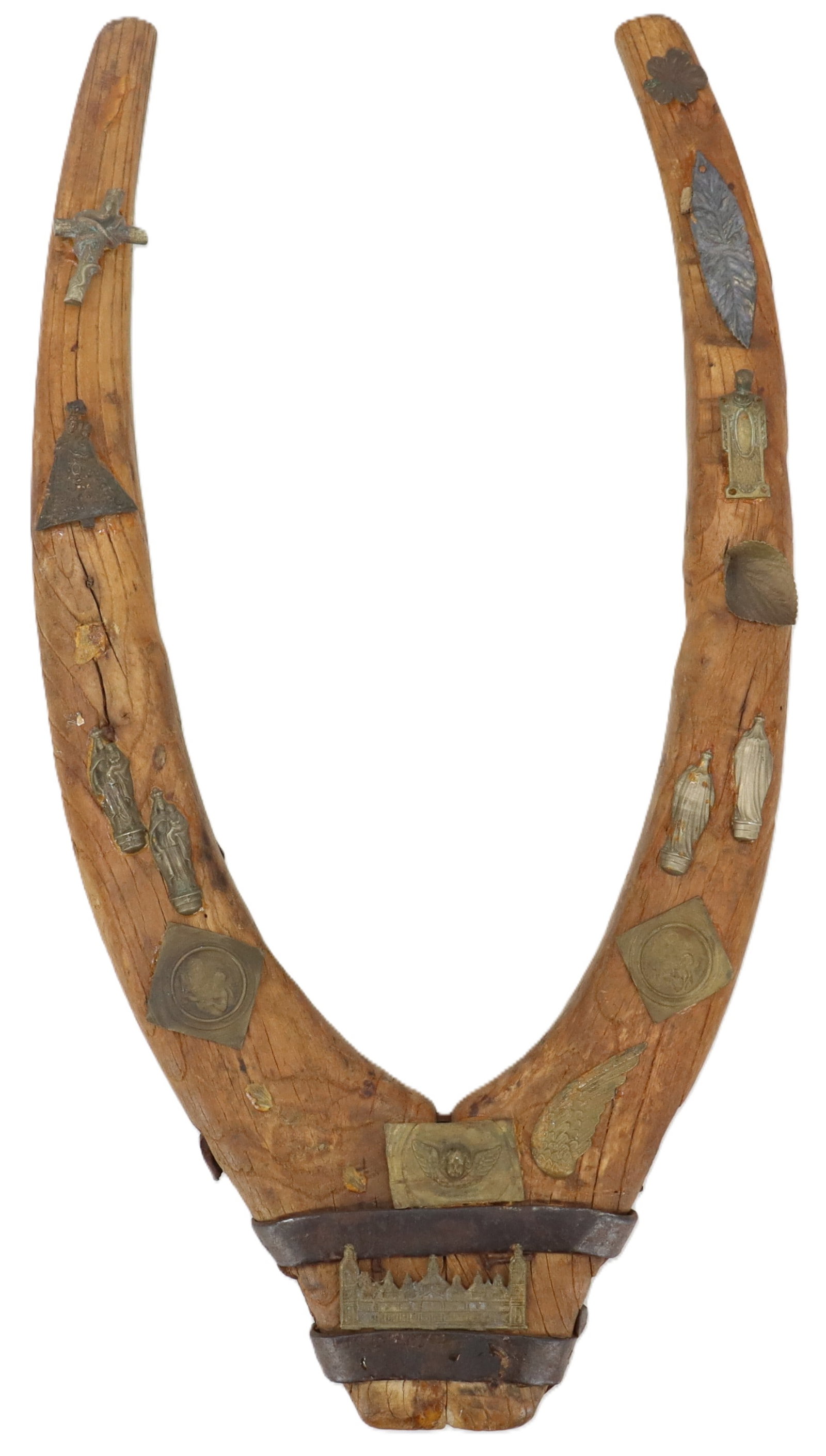 Antique Wooden Horse Collar Harness: Antique Wooden Horse Collar Harness. Wishbone-shaped wooden horse hames (part of a heavy harness collar) adorned with various small, attached metal tokens, plaques, religious figures, and decorative