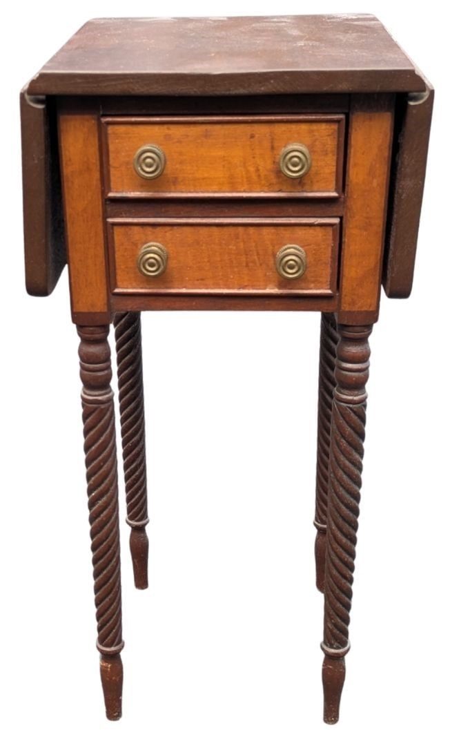 Empire Style Drop Leaf Work Table With Spiral Turned Legs: Empire Style Drop Leaf Work Table With Spiral Turned Legs. Rectangular main surface flanked by two short rounded drop leaves. Case features two stacked drawers with light wood (tiger/curly m