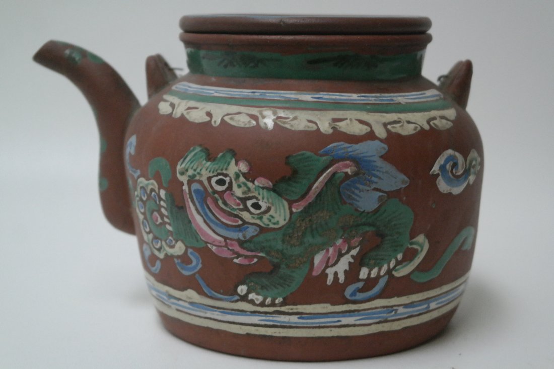 Early 20th Century Chinese Ceramic Tea pot: Early 20th Century Chinese Ceramic Tea pot. With animal figure hand painted on the front and a floral design on the back. Marked on the bottom. Height: 5.5 inches.