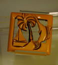 Yellow Bakelite Pin w/ marlin, sailboat & palm tree