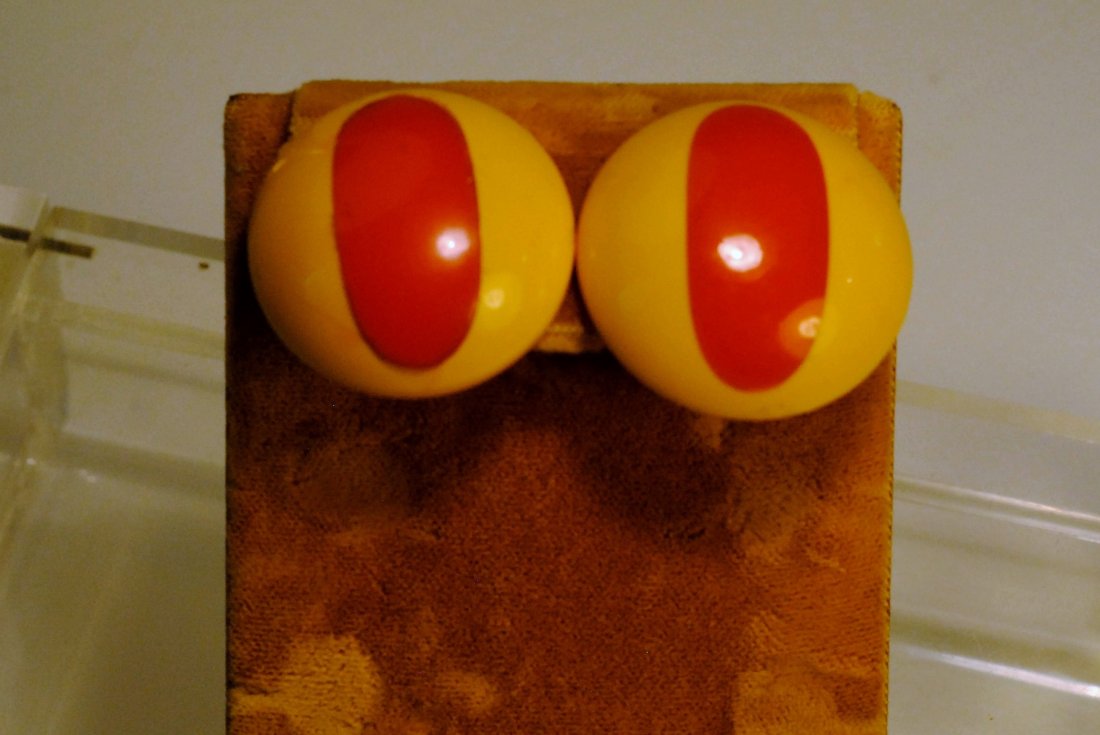 Yellow/Red-Orange Cat Eye Bakelite Studs: Bakelite studs constructed in yellow, and red-orange bakelite with cat eye design.