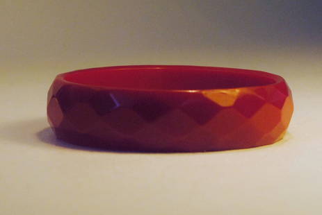 Red Bakelite Bangle w/ Diamond Motif: Red Bakelite bangle with carved diamond motif