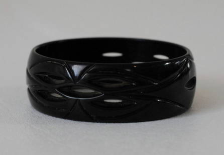 Black Bakelite Bangle w/ Carvings: Black Bakelite bangle with carvings