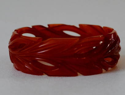 Amber Brown Bakelite Bangle: Amber brown Bakelite bangle with carvings