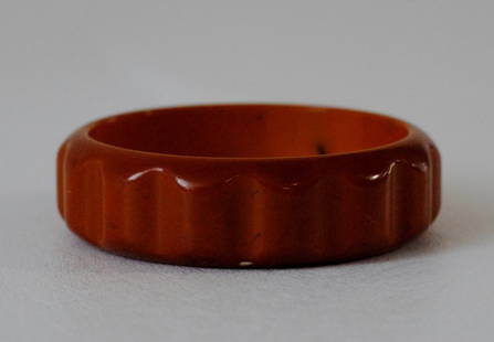 Amber Bakelite Bangle w/ Rounded Rectangular Carvings: Amber brown colored Bakelite bangle with rounded rectangular carvings