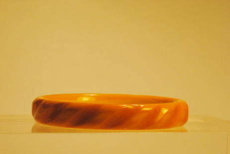 Yellow/Amber Bakelite Bangle w/ Carved Design: Yellow/amber bakelite bangle with carved design