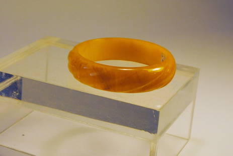 Yellow Czech Bakelite bangle w/ rounded carving: Yellow colored bakelite bangle with rounded diagonal line carvings