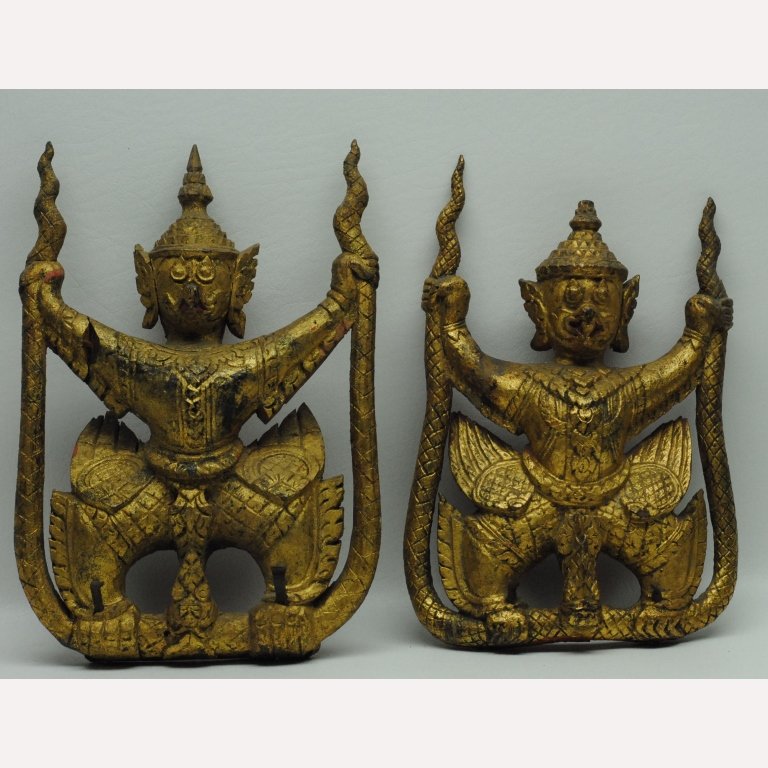 Antique 19th C Thai Buddhist Garuda Figures: Pair of antique Thai Buddhist carved Garuda figures in wood construction having gilt painted bodies with red accents and reverse. Height: 9.5 in