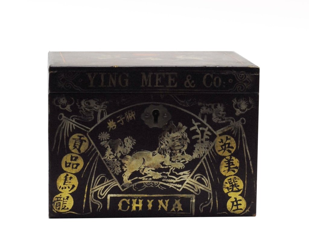 Chinese Yee Ming & Co Tea Box: Wooden tea box from the Ying Ming & Co having gilt painted design with stylized foo dogs and phoenixes.