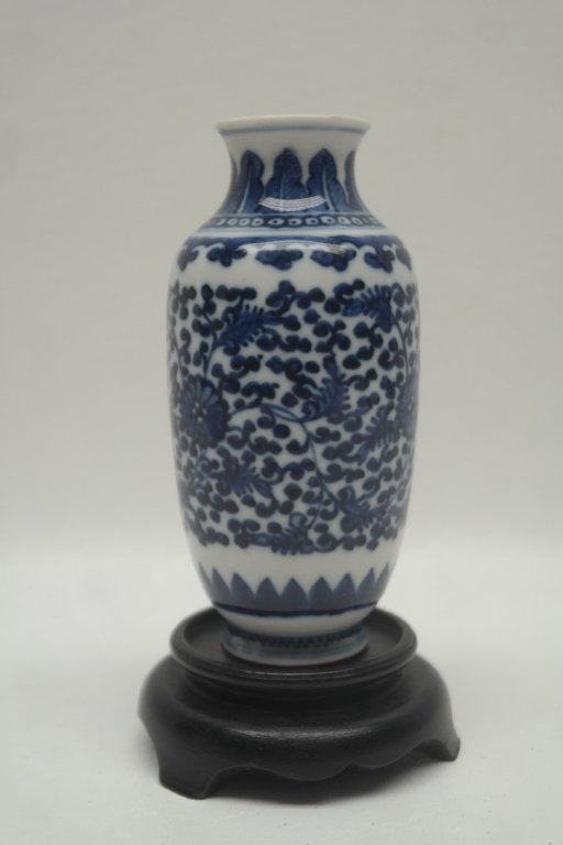 19th C Chinese Blue & White Porcelain Vase: Antique blue and white porcelain vase having flared rim and footed base. Body having stylized lotus blossoms. Height: 5 in