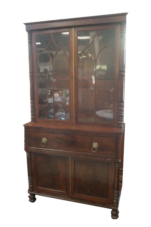 Antique Secretary Desk: Antique Secretary desk having turned detailing. Also having lion's head escutcheons. Dimensions: 87 x 46 x 20.5 in