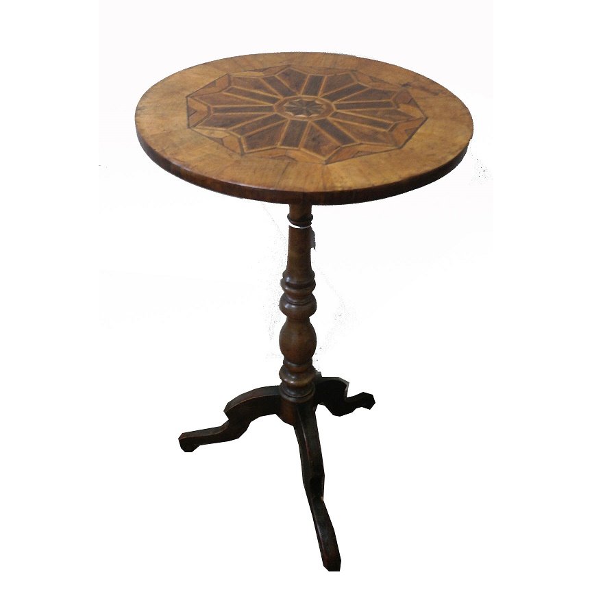 Antique Tilt Top Table: Antique tilt top table having tri-footed base. Having inlaid wood design to top and turned stem. Height: 28.5 inches. Diameter of surface: 16.5 inches