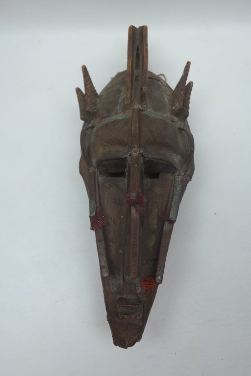 Antique African Mask: Antique African Mask having carved horns. Also with metal applied to face.