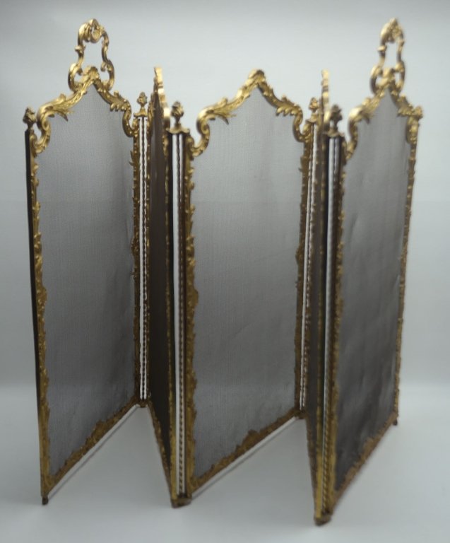 French Antique Gilt Bronze Fire Screen: Antique French gilt bronze fire screen, having scrolling floral motif border.