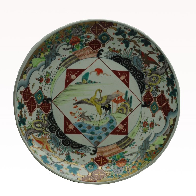 Antique Imari Charger: Circa 1900 Antique Imari charger having imagery of Mount Fuji and stylized figures of a phoenix and dragon. Diameter:18 inches.