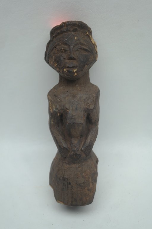 Antique African Figure: Antique African carved figure in wood construction.