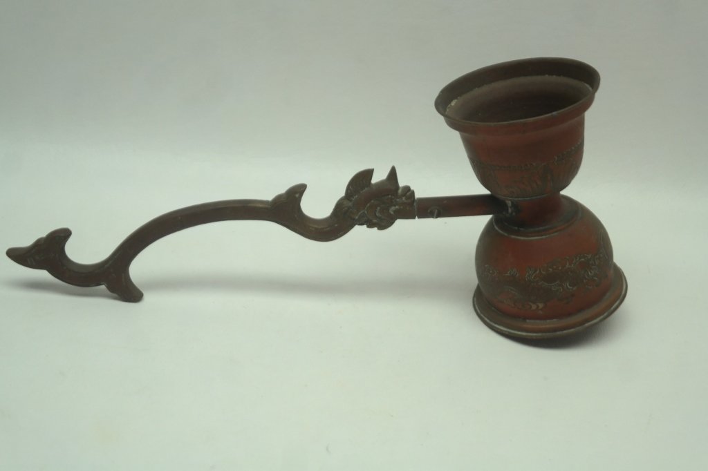 Antique Chinese Large Ceremonial Laddle: Antique Chinese ceremonial large jigger having depictions of dragons. Handle is in form of stylized mythical beast having horn. With evidence of original red paint. Having signature on body of handle,