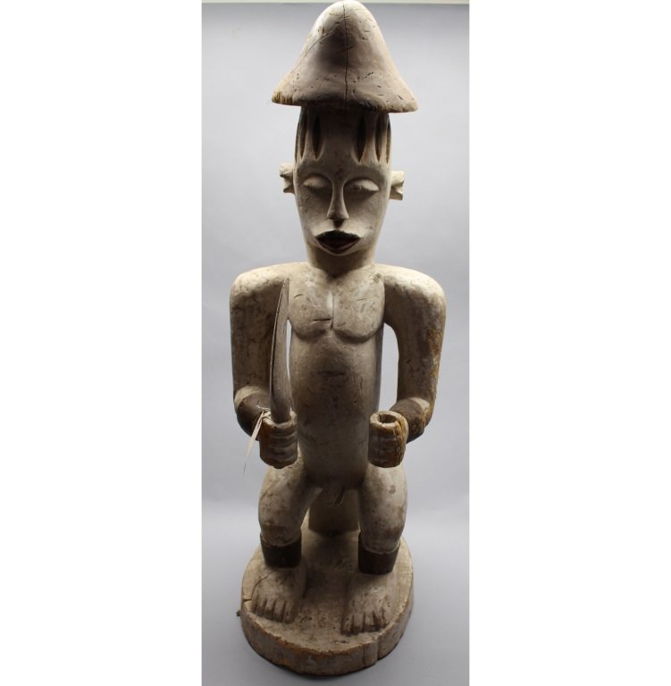 Monumental Nigerian Urhobo Statue w/ Original Paint: Monumental 1917 antique Urhobo Carved Statue w/ original paint. Inscribed on base. Height: 38 inches.