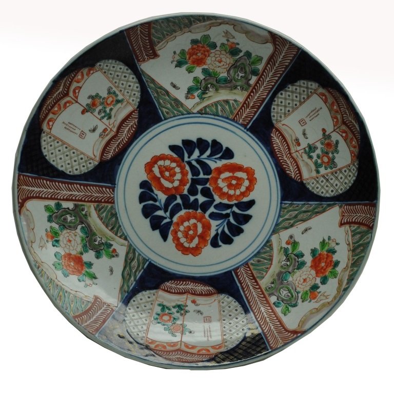 Antique Imari Charger: Circa 1900 Antique Imari charger having imagery of Mount Fuji and stylized figures of a phoenix and dragon. Chip on the rim. Diameter: 16 in.