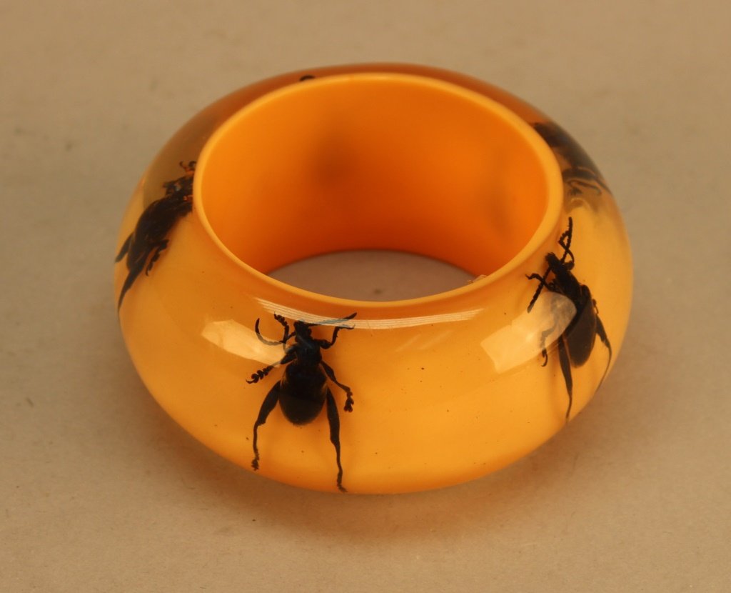 Peach Lucite Bangle w/ Beetle Decoration: Peach Lucite Bangle w/ Beetle Decoration. Diameter: